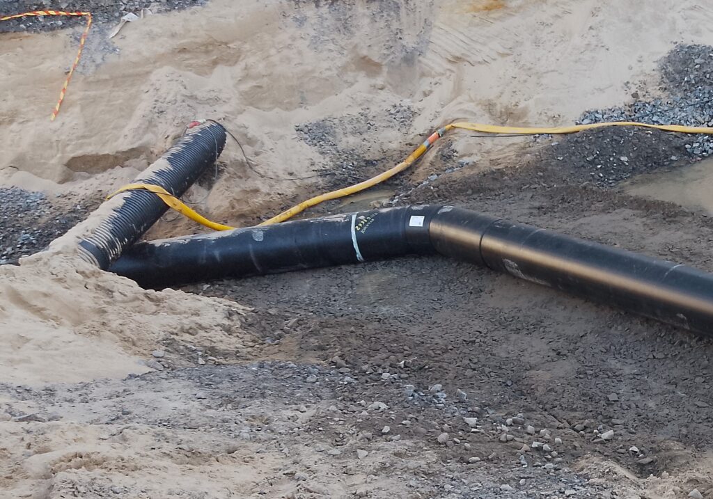 Completed underground circulating infrastructure pipeline in the ground.