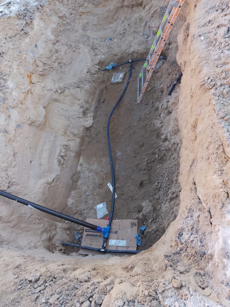 Completed small underground infrastructure pipeline in a pit.