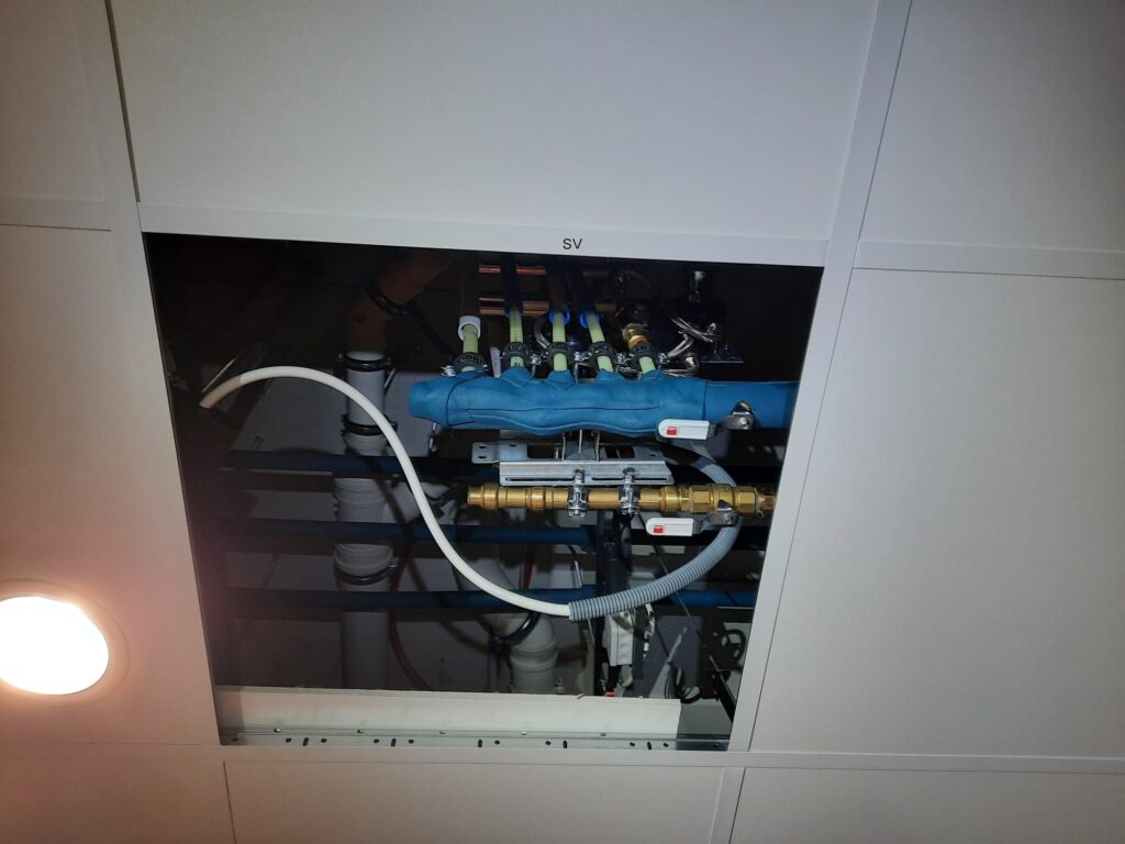 Building services systems installed above the suspended ceiling in a different location.