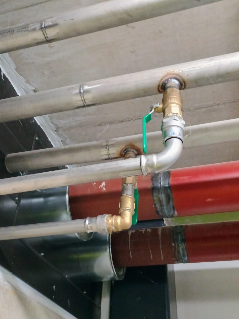 Finished heating and cooling piping installations up close.
